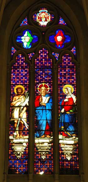 Stained glass window from a chapel with Jesus as central figure-0