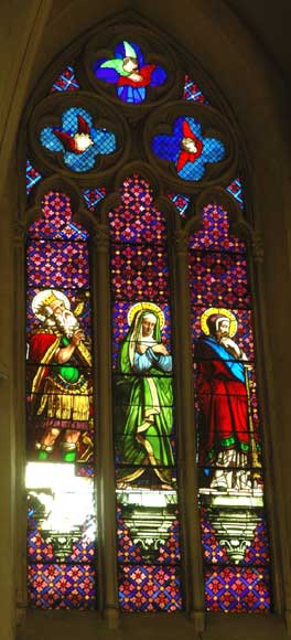 Stained_glass_window_from_a_chapel_with_Mary_as_central_figure.jpg