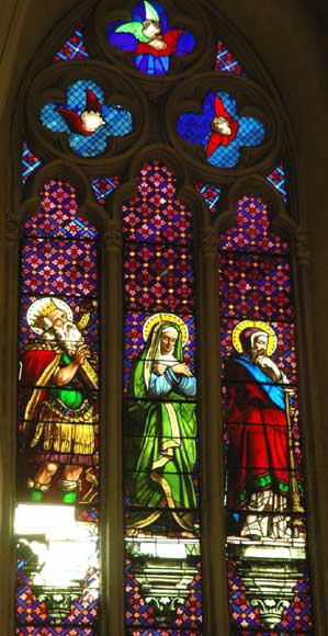 Stained glass window from a chapel with Mary as central figure-1