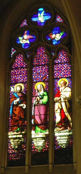 Stained glass window from a chapel with Saint Anne as central figure -0