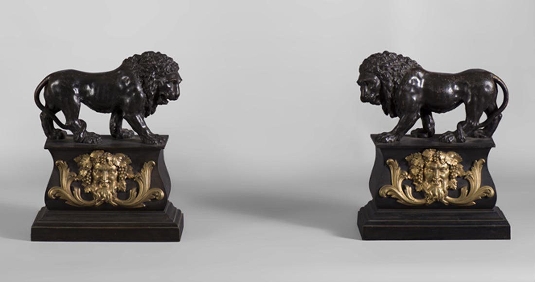 Pair of antique andirons in patinated bronze and gilt bronze with lions and Bacchus' masks, from 19th century.-0
