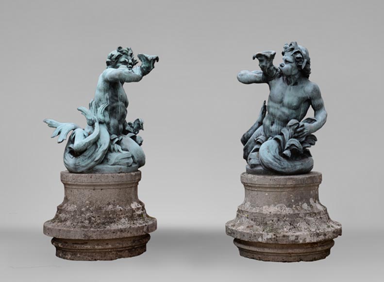 Important Louis XIV style pair of Tritons sounding a conch shell in bronze with green patina