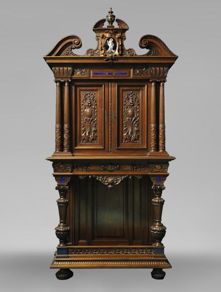 Two-body cabinet, in th Neo-Renaissance style, in carved walnut with enamel and lapis-lazuli inlays-0