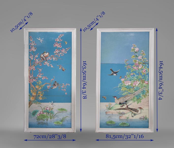 A pair of ceramic panels with birds in a lacustrine scenery signed 