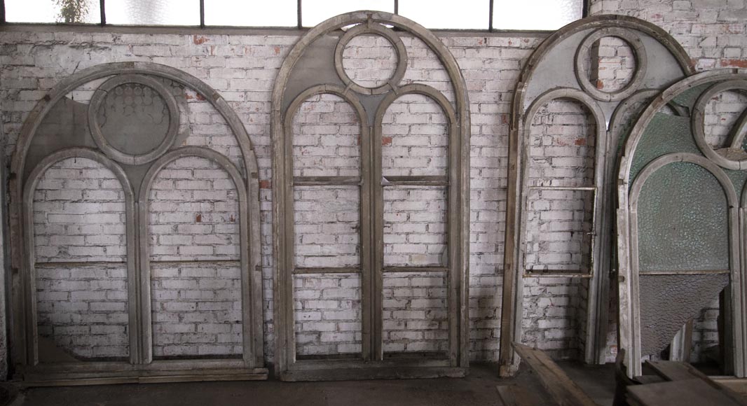 Arched wooden window frames and coloured glass-2