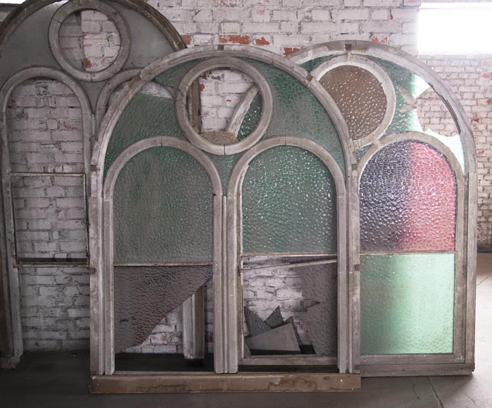 Arched wooden window frames and coloured glass-6