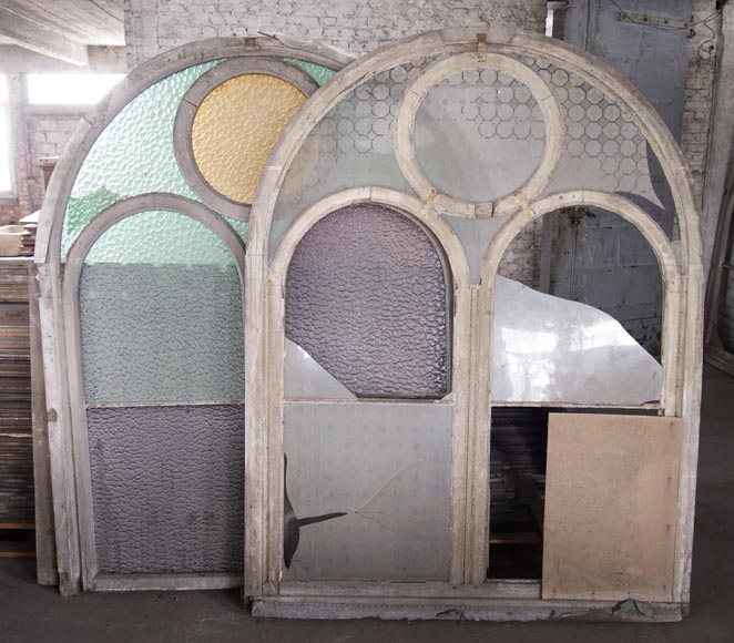 Arched wooden window frames and coloured glass-7