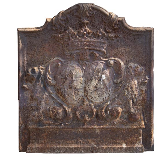 An old 18th century fireback with coat of arms and sitting lions-0