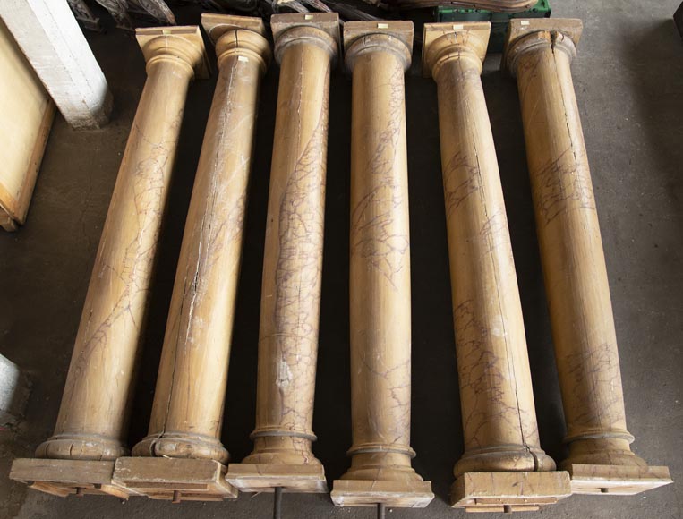 Set of wooden columns painted in imitation marble-0