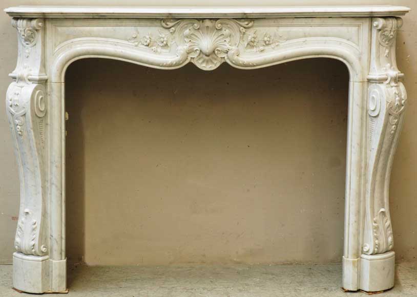 Carrara_marble_Louis_XV_style_mantel_with_shell_decoration_and_scrolled_jambs.jpg