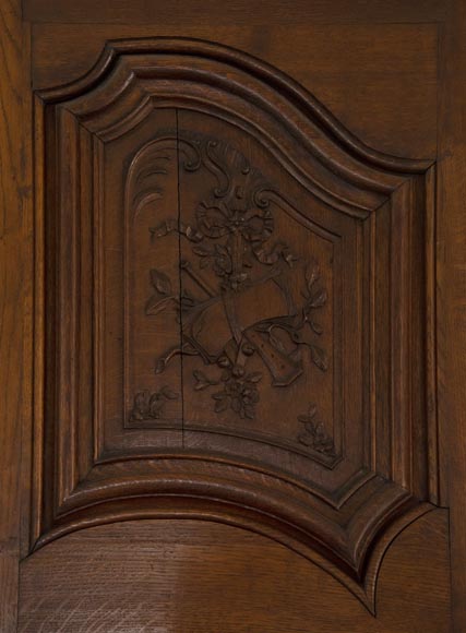 Double door in carved oak decorated with military trophies-2