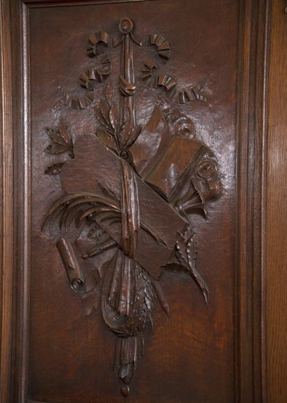 Double door in carved oak decorated with military trophies-6