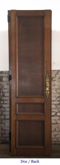 Double door in carved oak decorated with military trophies-8