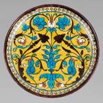 Théodore DECK (1823-1891) - Round ceramic dish with oriental decoration of a vase of flowers and foliage on yellow background
