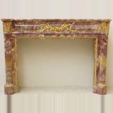 Louis XVI style mantel in Fleur de Pêcher marble and guilt bronze - Reference 1242&nbsp;Width&nbsp;4' 9'' ½&nbsp;Height&nbsp;3' 9'' ¼