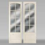 Pair of simple doors with a mirror on one side