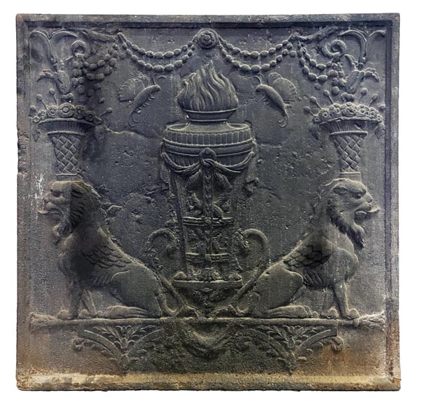 Fireback of the 18th century depicting a vase on a tripod with fire framed by two chimeras supporting baskets of fruit-0