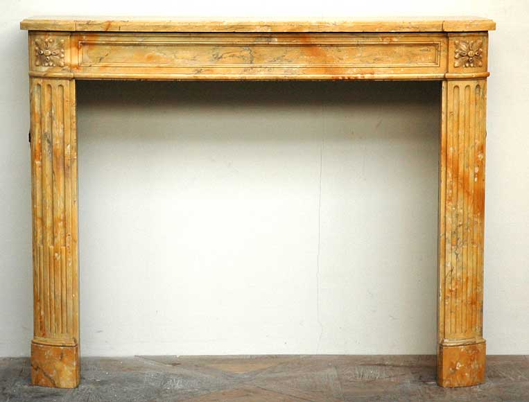 Louis_XVI_mantel_in_yellow_from_Sienna_marble.jpg