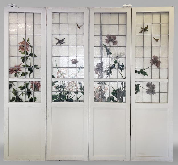 Quadruple sliding door with stained glass windows featuring birds and plants-0