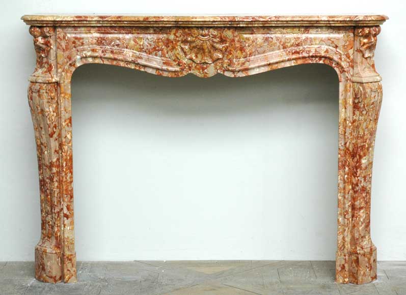 Louis_XV__Saint_Maximin_marble_three_shell_mantel_.jpg