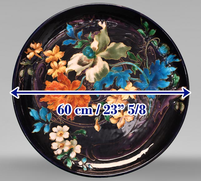 Théodore DECK, circular dish decorated with flowers on an eggplant background, after 1870-6