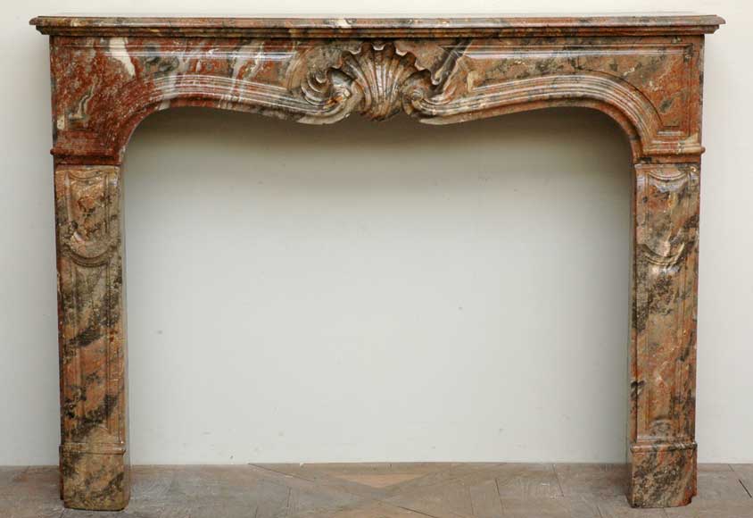 Louis_XV_style_mantel_in_red_marble_from_the_Ardennes.jpg