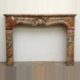 Louis XV style mantel in red marble from the Ardennes