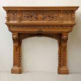 Neo-Renaissance style walnut mantel with grotesques