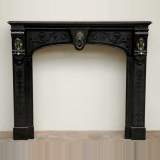 Black Engraved Marble Mantel with bronze heads