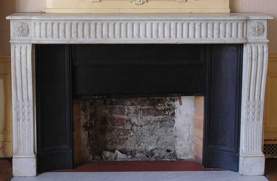 Antique_Louis_XVI_period_white_marble_mantel_with_19th_century_cast_iron_insert.jpg