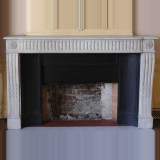 Antique Louis XVI period white marble mantel with 19th century cast iron insert
