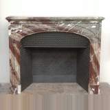 Antique Louis XIV mantel in Campan Grand Mélange marble