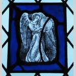 Four stained glasses with greyness angels