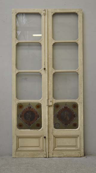 Double door with stained glass windows,  man and woman's profile in medallion-0