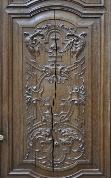False pair of antique  carved oak doors from the 19th century-4