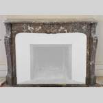 Antique Louis XV style fireplace in Red from the North marble, 19th century