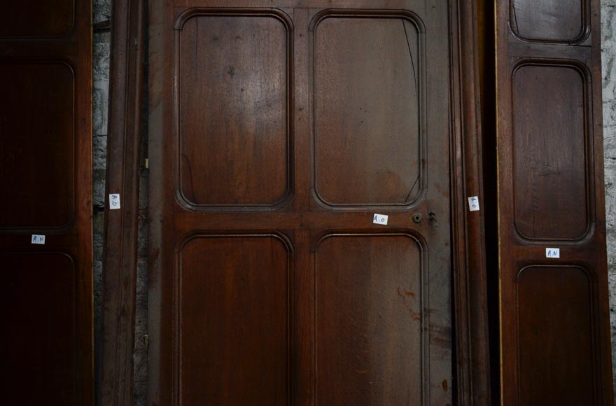 Antique large door in oak with paneled decoration, circa 1900-2
