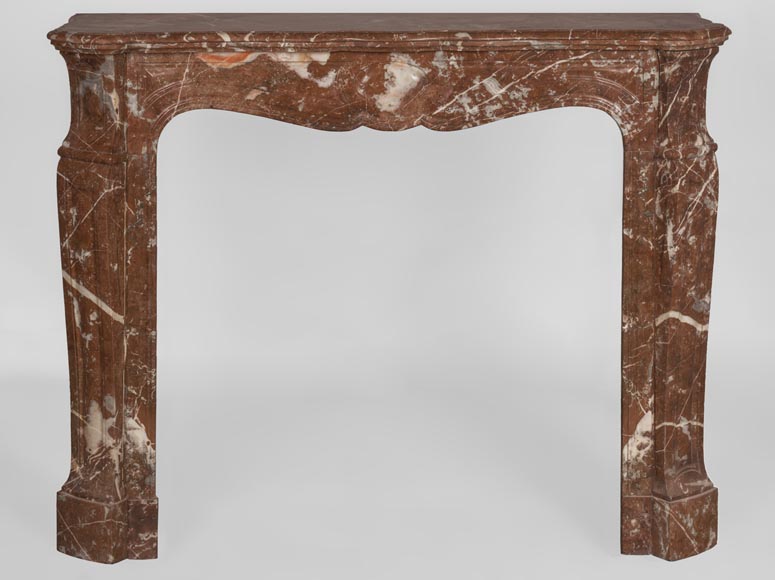 An antique Louis XV style fireplace, Pompadour model, made out of Rouge du Nord marble-0