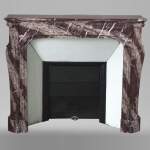 An antique Louis Xv style fireplace, Pompadour model, made out of Campan rubané marble