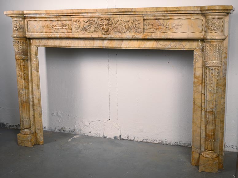 Large Louis XVI style mantel in yellow Sienna marble with entablature adorned with the head of Apollo and arrow heads on the jambs-9