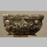 Gothic stone capital with coat of arms