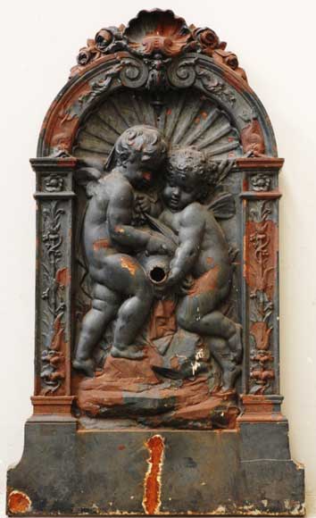 Cast_iron_fountain_with_two_putti.jpg