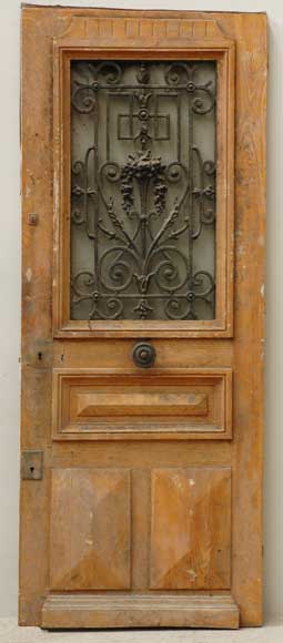 Wood_19th_century_door_with_wrought_iron_grille.jpg