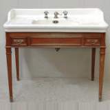 Lavabo émaillé sur meuble en acajou