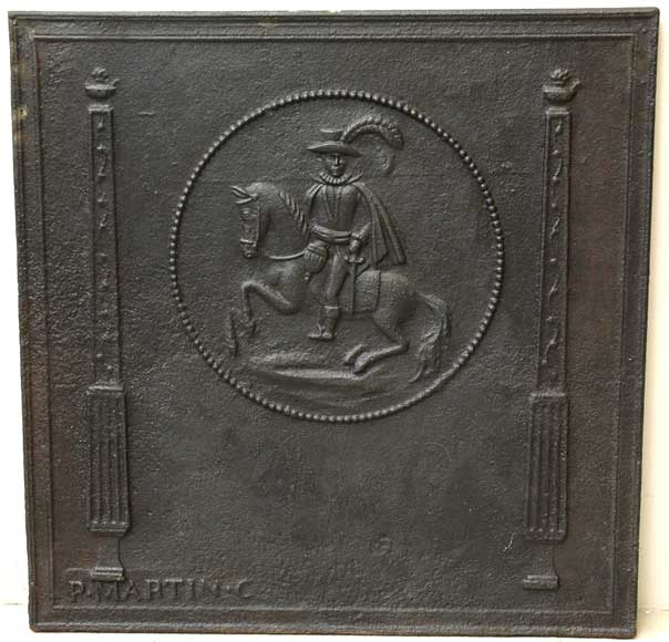 Cast_iron_fireback_with_horse_rider.jpg