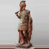 Cast stone statue of soldier with terra cotta patina