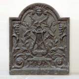 Cast iron fireback with lyre