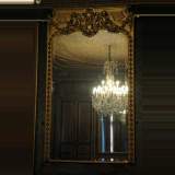 Antique Gilded mirror with putti and mask