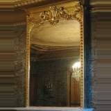 Antique Gilded trumeau with putti and mask