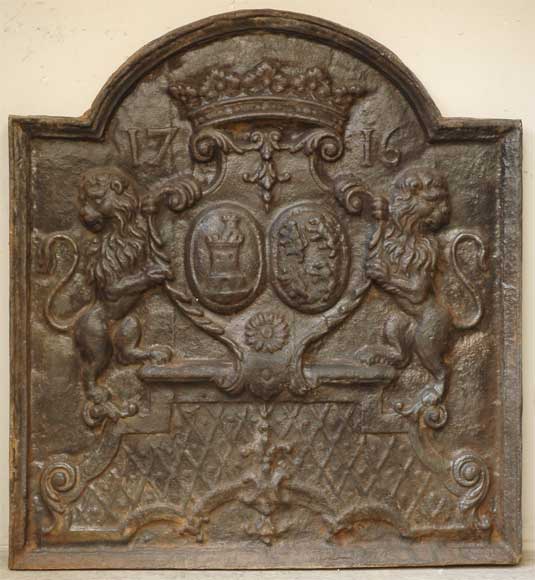 Cast iron fireback with two lions